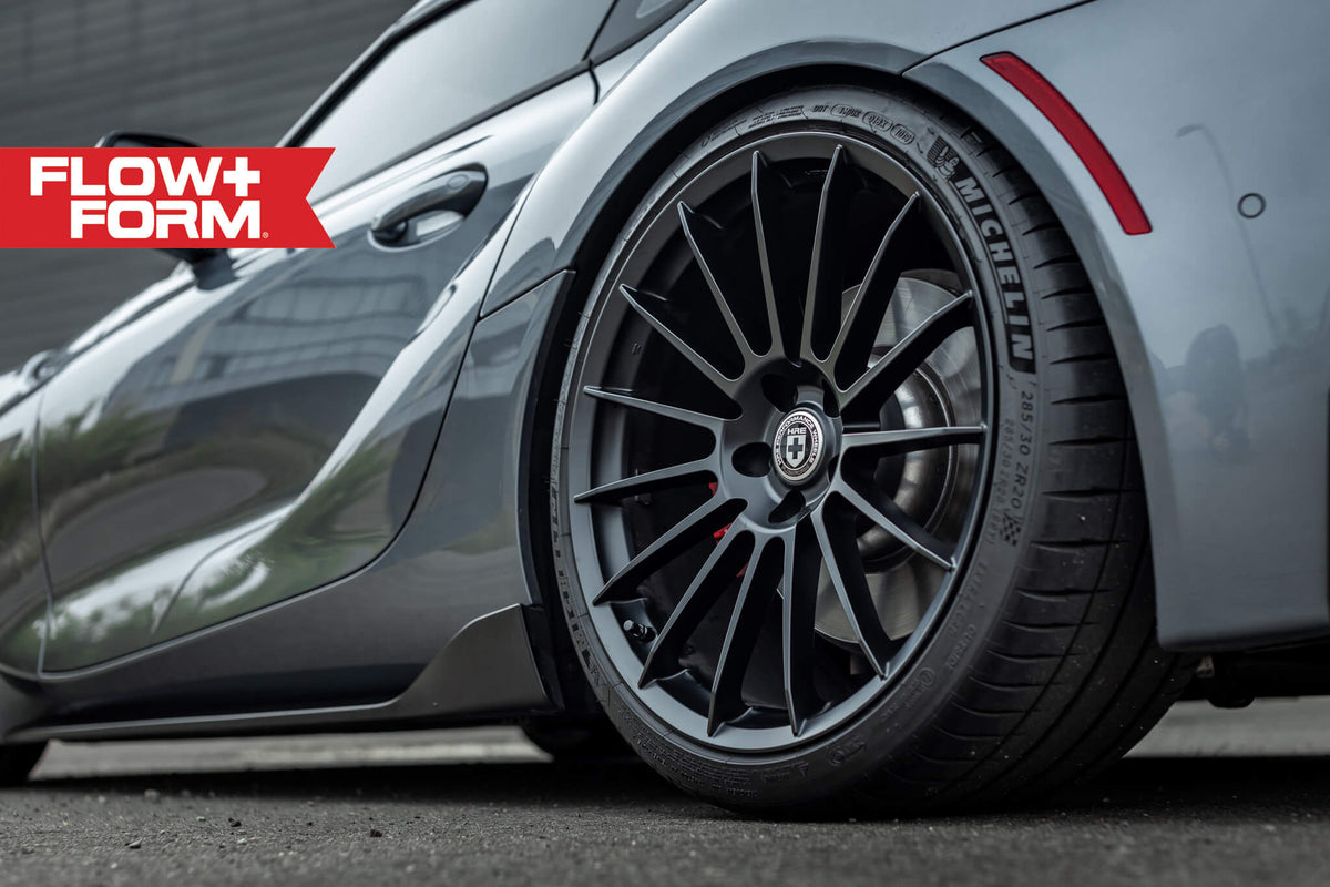 HRE PERFORMANCE WHEELS FF15 alloy wheels with multi-spoke design and polished finish, displayed on a vehicle.