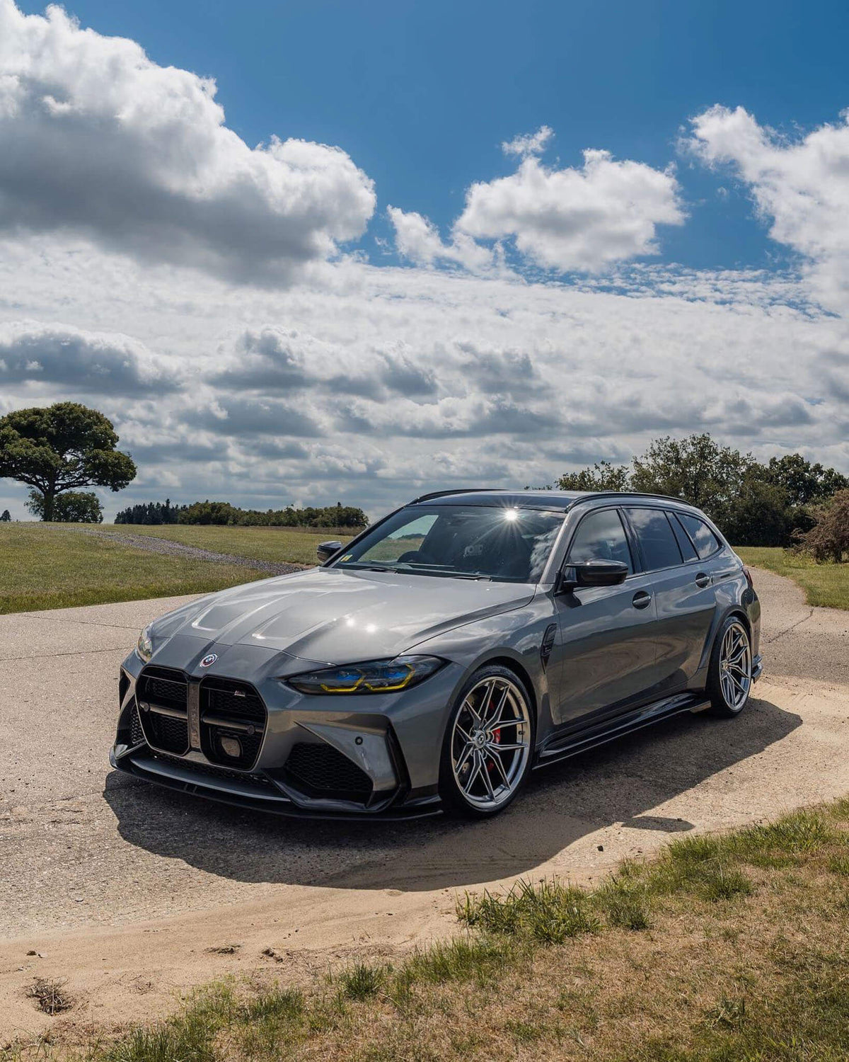 HRE PERFORMANCE WHEELS FF21 alloy wheel with a sleek, multi-spoke design in a polished finish, shown installed on a vehicle.