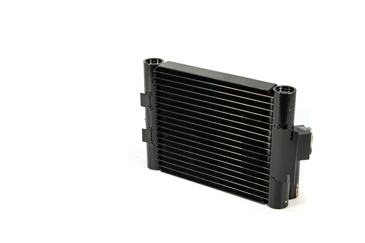 CSF Race-Spec Oil Cooler for BMW M2, metal radiator with hoses and fittings, designed for high-performance engine cooling.