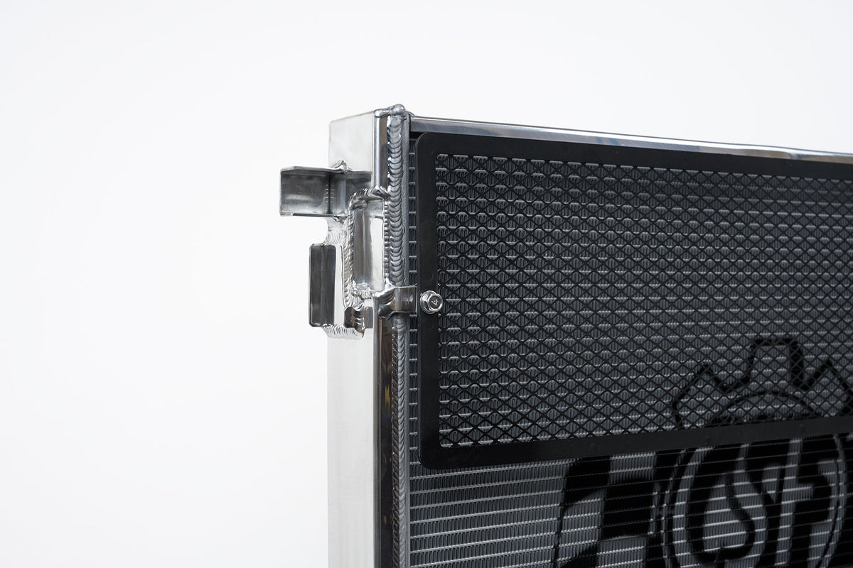 CSF front mount heat exchanger radiator for G8X M3 and M4, showing the core and mounting points in a close-up view.