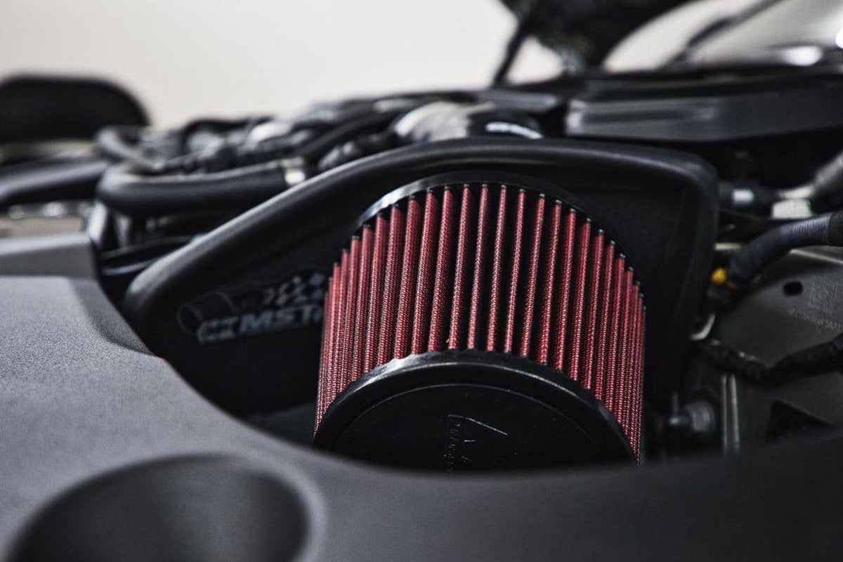 MST Performance induction kit installed in a BMW M5 and M8, showcasing the high-performance air intake components.