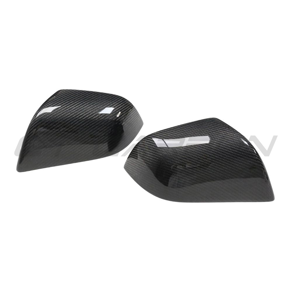 Carbon fibre side mirror covers for Tesla Model 3 (2017-2023) by CT Carbon, showing sleek, lightweight accessory enhancements.
