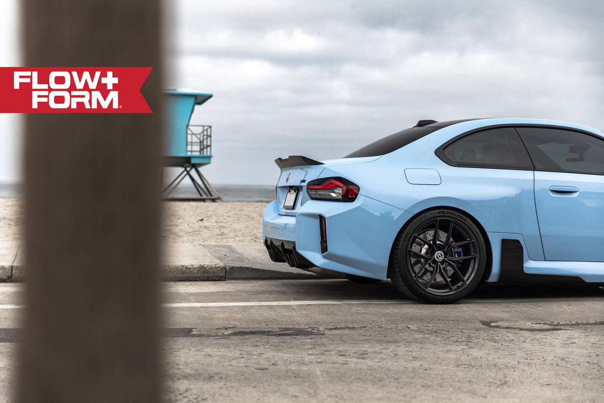 HRE PERFORMANCE WHEELS FF21 alloy wheels with multi-spoke design and polished finish, shown on a vehicle.