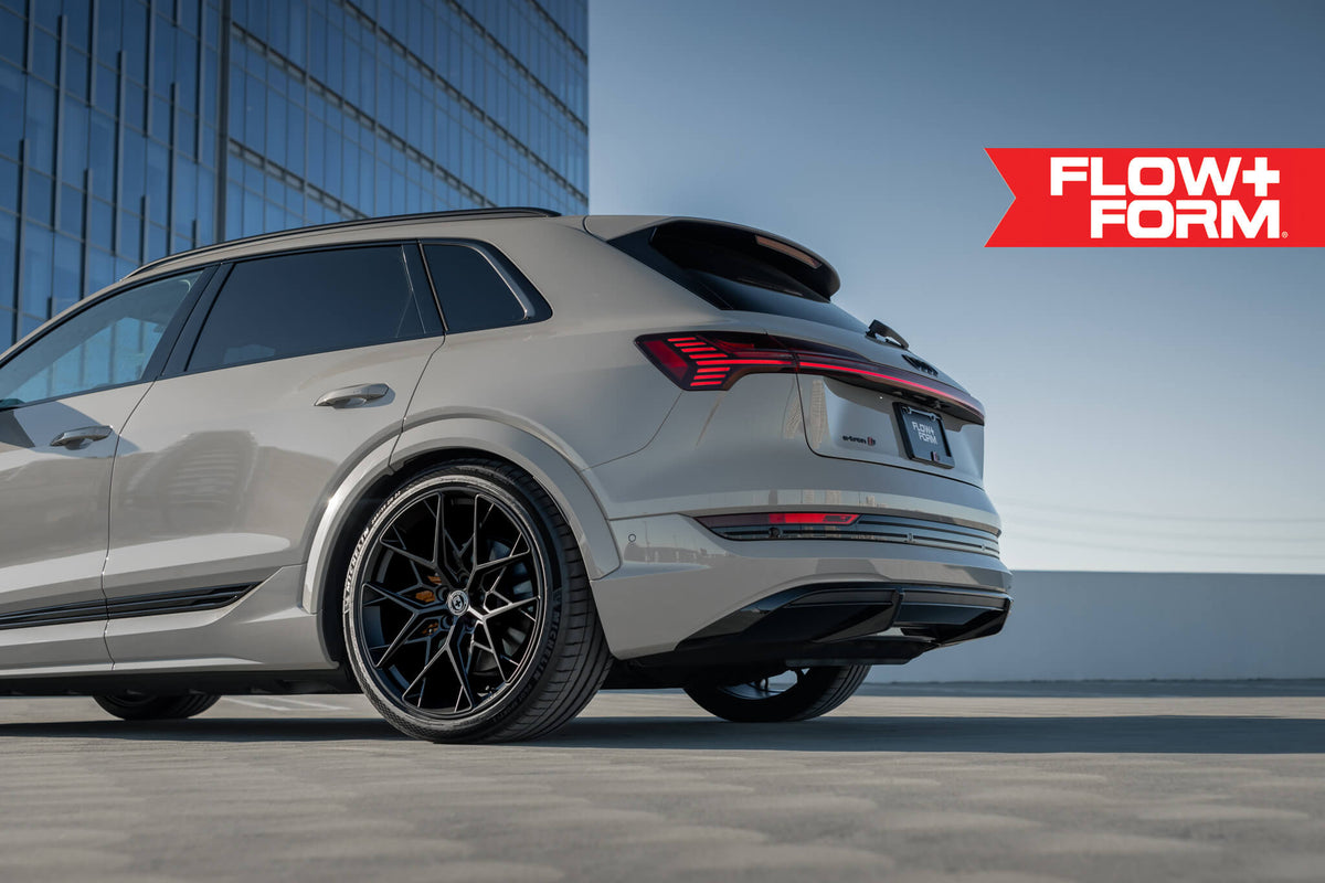 HRE PERFORMANCE WHEELS FF10 wheel showing a sleek, multi-spoke design in a polished finish on a black background.