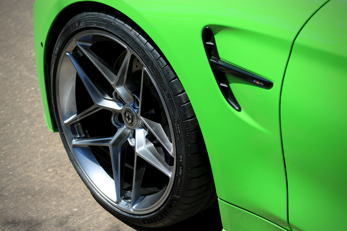 HRE PERFORMANCE WHEELS FF11 alloy wheels with multi-spoke design and polished finish, mounted on a vehicle.
