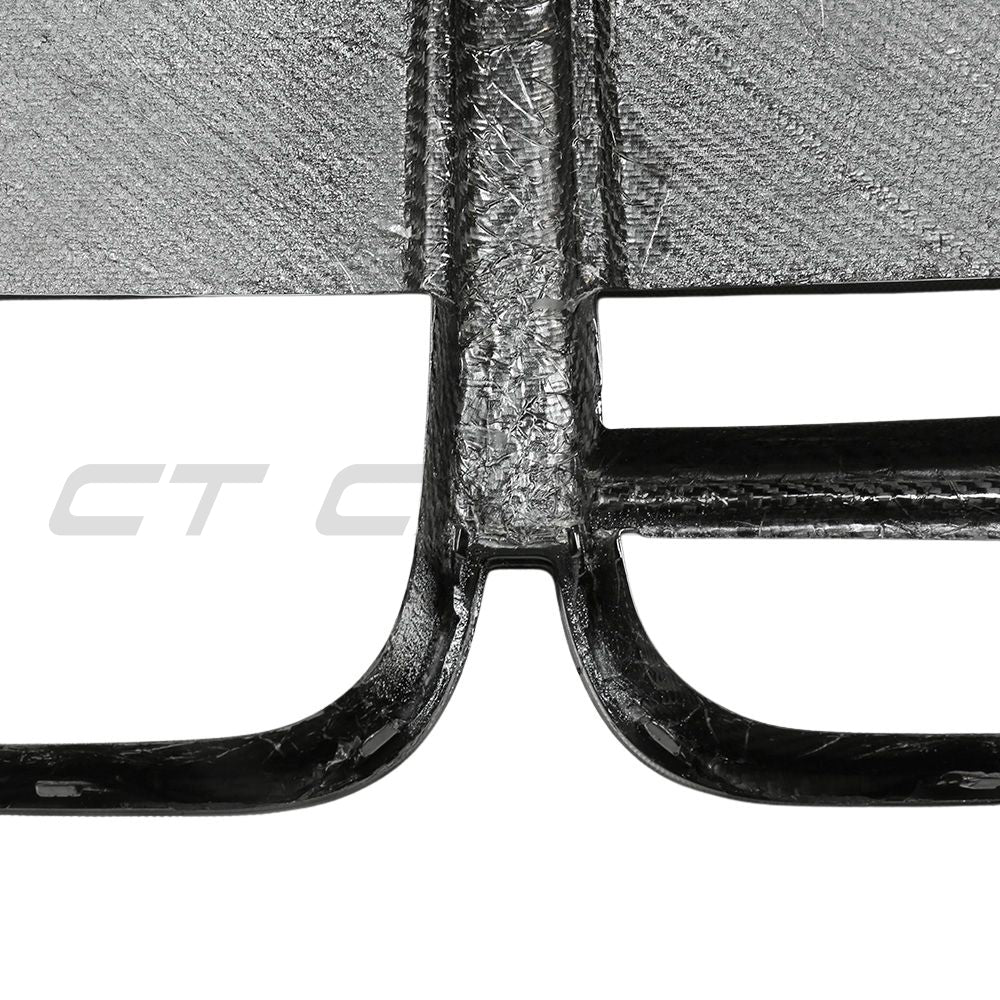 BMW 4 Series G22 G23 carbon fiber CSL grille with ACC from CT Carbon, showing close-up of sleek, textured carbon fiber design.