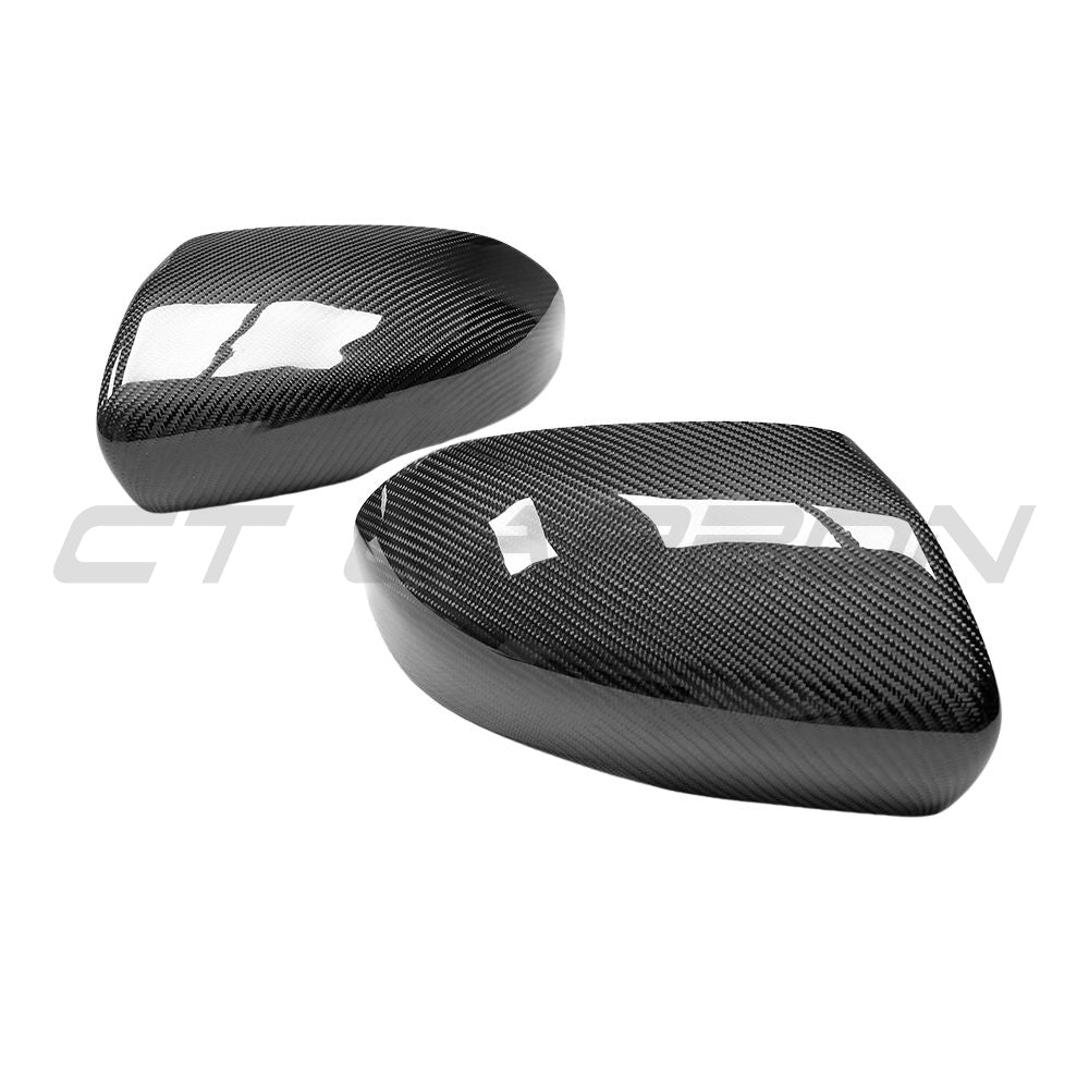 Carbon fibre side mirror covers for Land Rover Range Rover Evoque L538 2012-2013 by CT Carbon, showcasing sleek, textured finish.