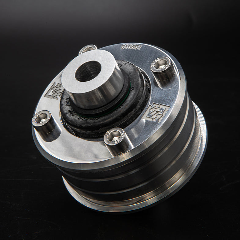 Suspension Secrets solid front control arm bushes for BMW F20 M135i and M140i suspension linkages, showing the durable rubber bushings.