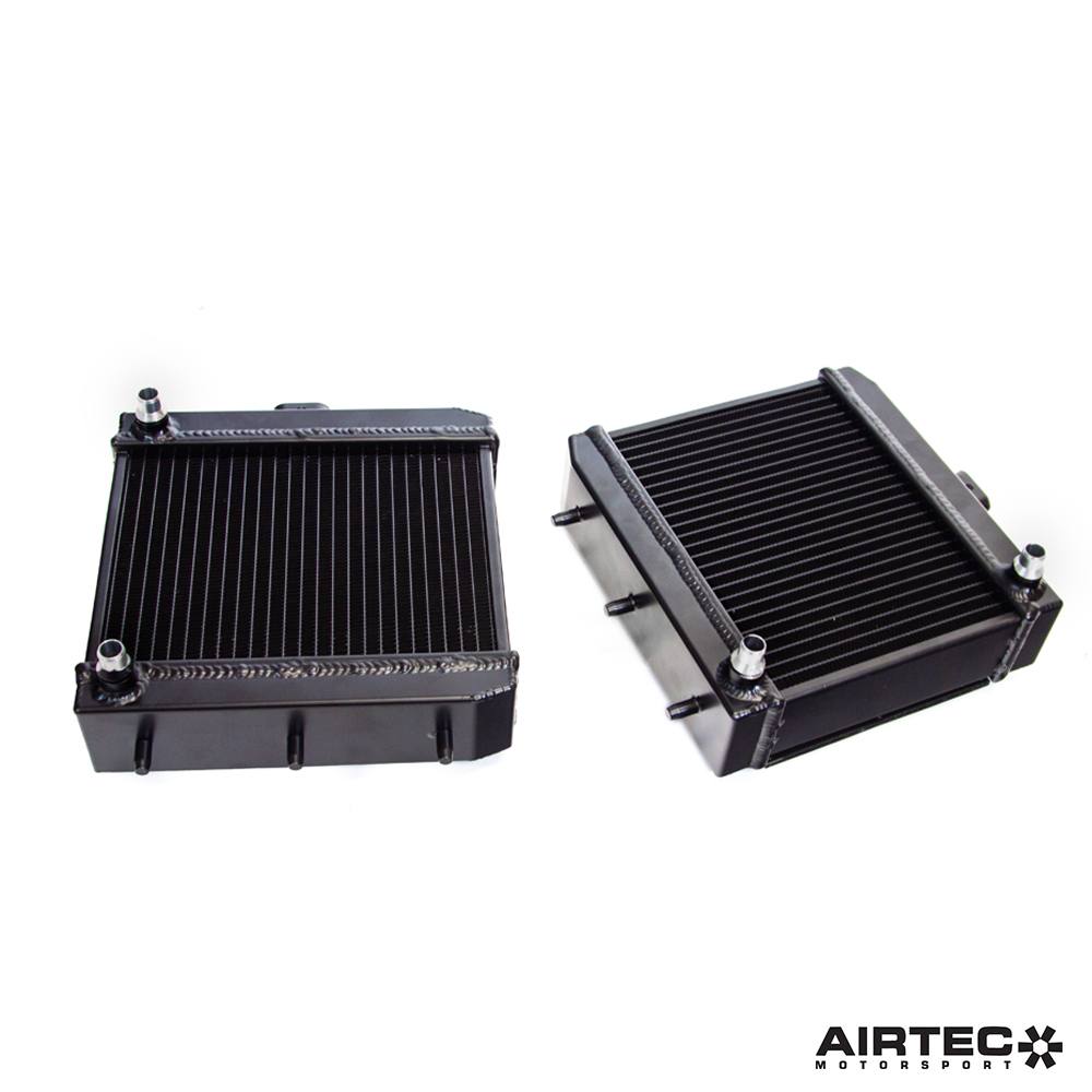 Airtec Motorsport side intercoolers for BMW S55, showing both left and right radiators with polished metal finish.