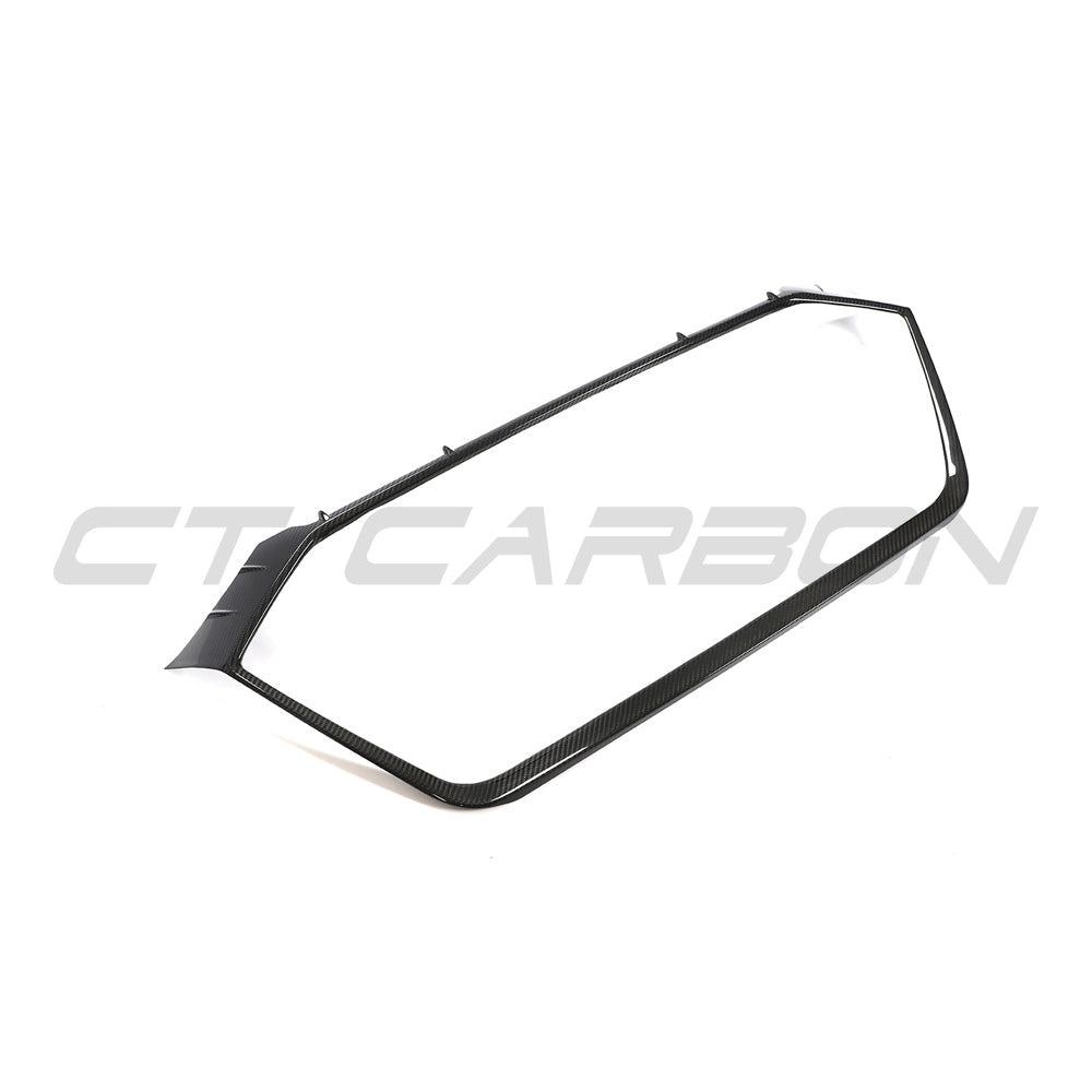 Audi RS6 and RS7 C8 Avant carbon fibre grille surround accessory by CT Carbon, showcasing sleek, textured carbon fibre design on vehicle front.