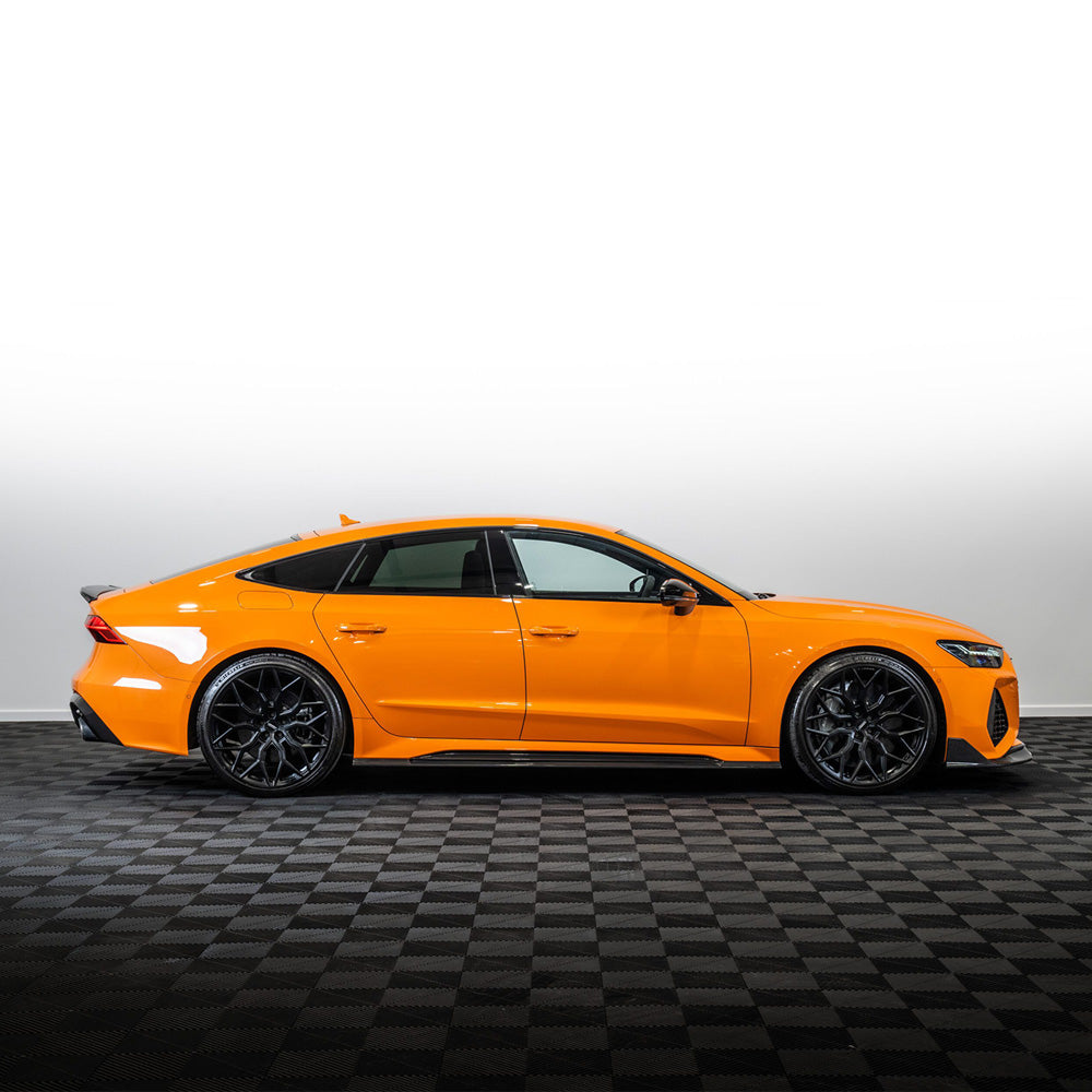 Audi RS7 C8 2019+ CT Design carbon fiber kit installed, showcasing sleek black carbon fiber parts on the luxury sport sedan.