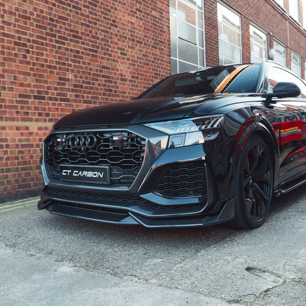 Carbon fiber front splitter for Audi RSQ8 2020-2025 by CT Carbon, showing the sleek, aerodynamic design on the vehicle's front.