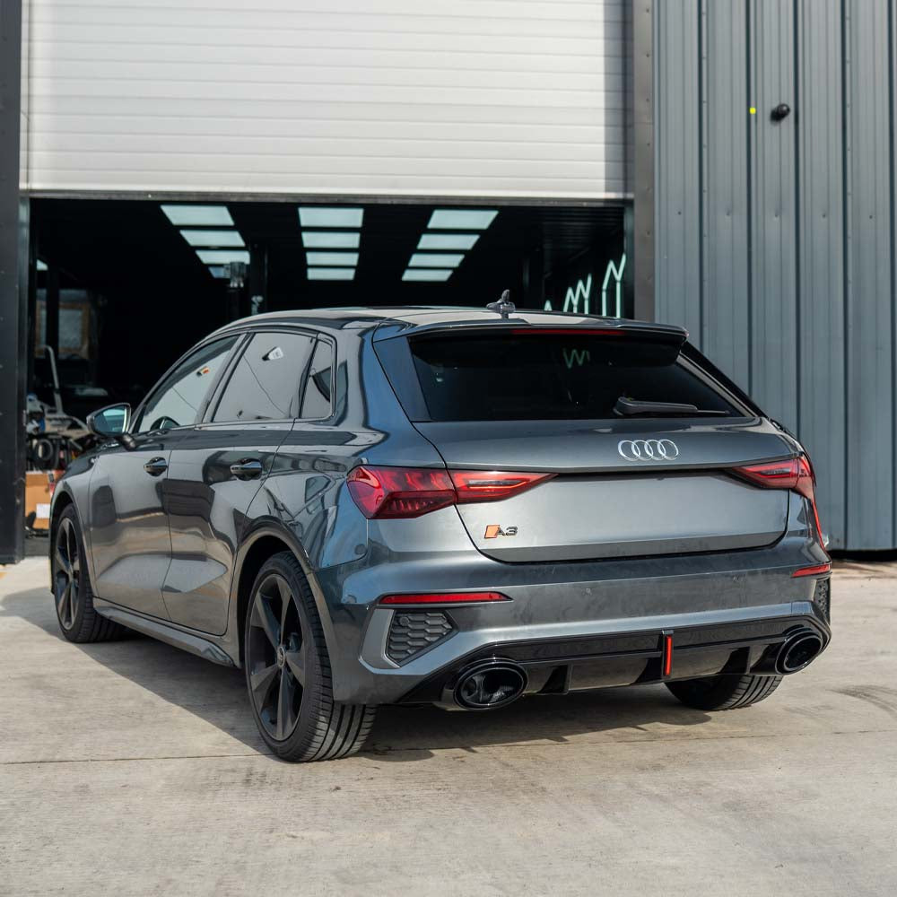 CT Carbon Audi S3/A3 8Y S-Line gloss black diffuser with tips and LED light, showcasing sleek automotive exterior styling.