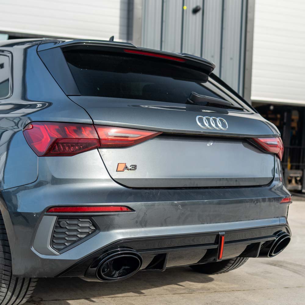 CT Carbon Audi S3/A3 8Y S-Line gloss black diffuser with tips and LED light, showcasing sleek automotive exterior enhancement.