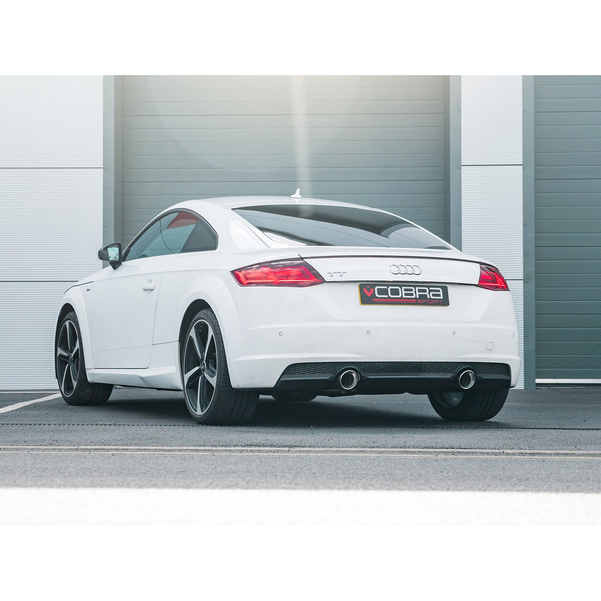 Cobra Sport cat back exhaust installed on Audi TT Mk3 2.0 TFSI FWD, showcasing the sleek exhaust system in a lifestyle setting.