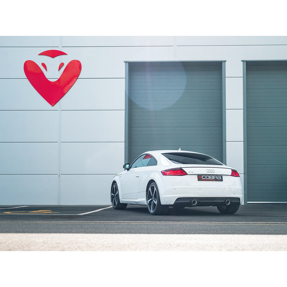 Cobra Sport Audi TT Mk3 2.0 TFSI cat back performance exhaust installed on a car, showcasing its sleek design and metallic finish.