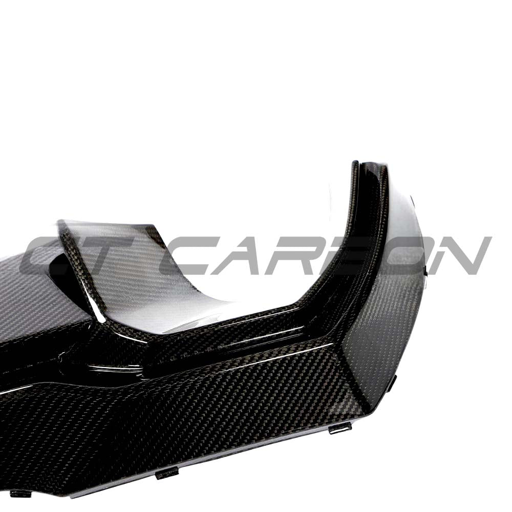 BMW 1 Series F40 carbon fiber diffuser by CT Design, showcasing sleek aerodynamic design and textured carbon fiber surface.