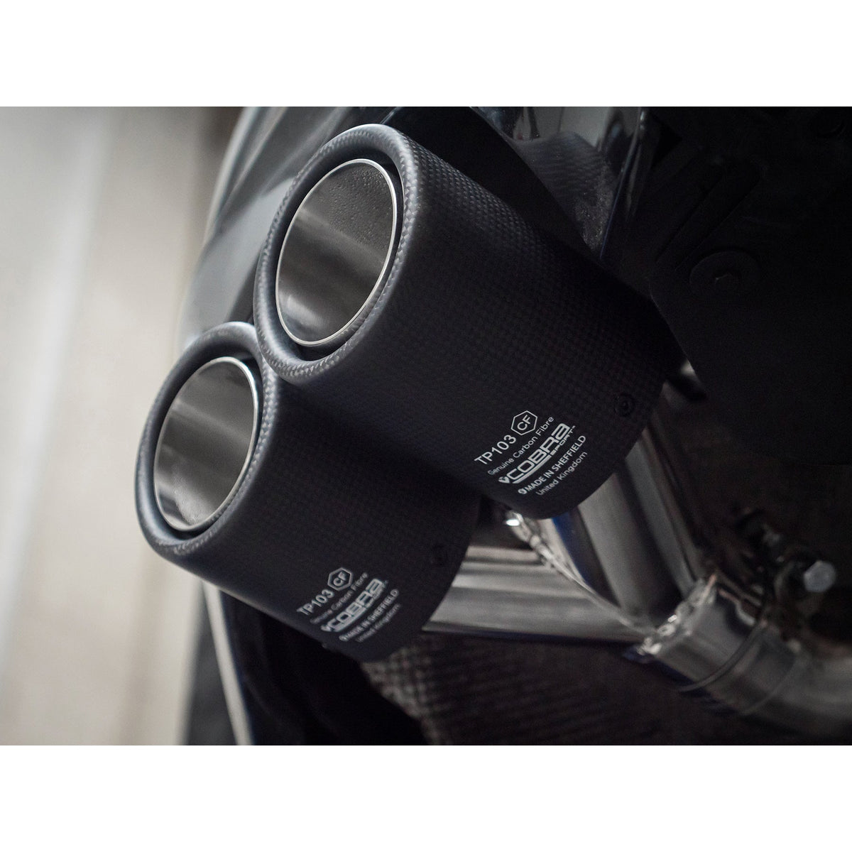 Cobra Sport BMW 320i G20 non-valved quad exit M3 style performance exhaust installed on the car.
