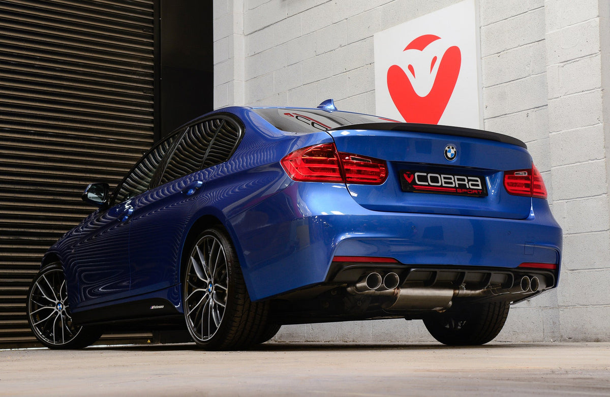 Cobra Sport quad exit performance exhaust conversion installed on a BMW 325D F30 LCI, showcasing M3 style twin tips.