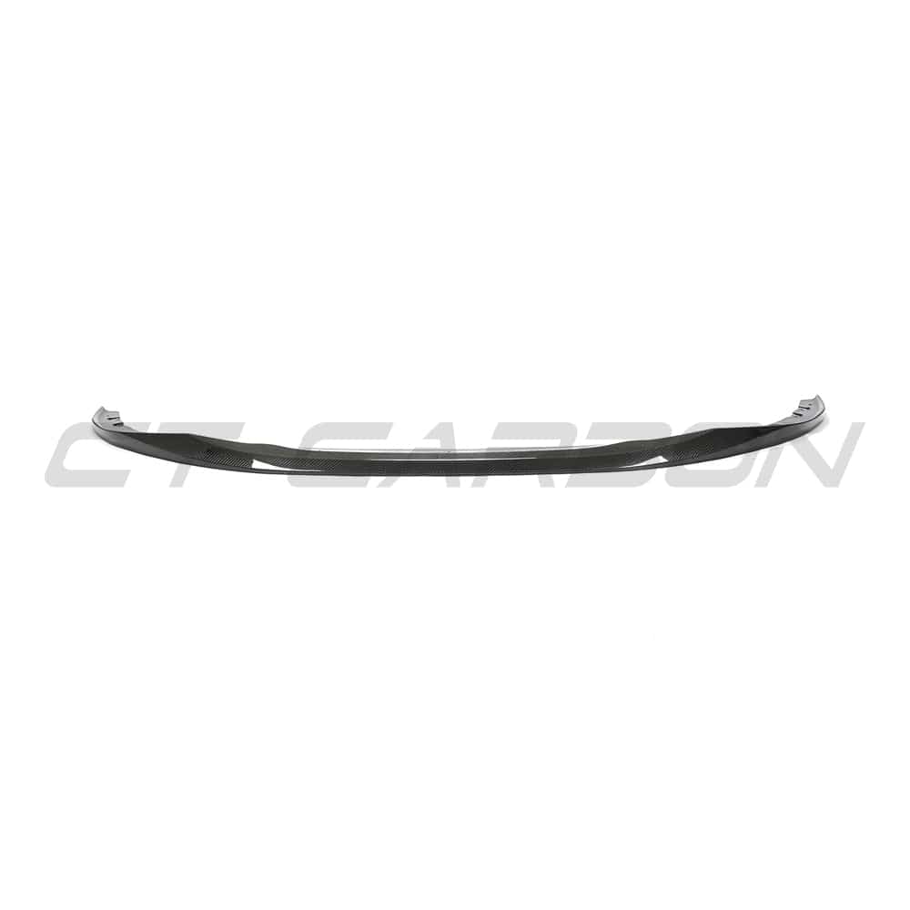 BMW G22 4 Series carbon fibre kit by CT Carbon, featuring splitter and V10 style components on a sleek car exterior.
