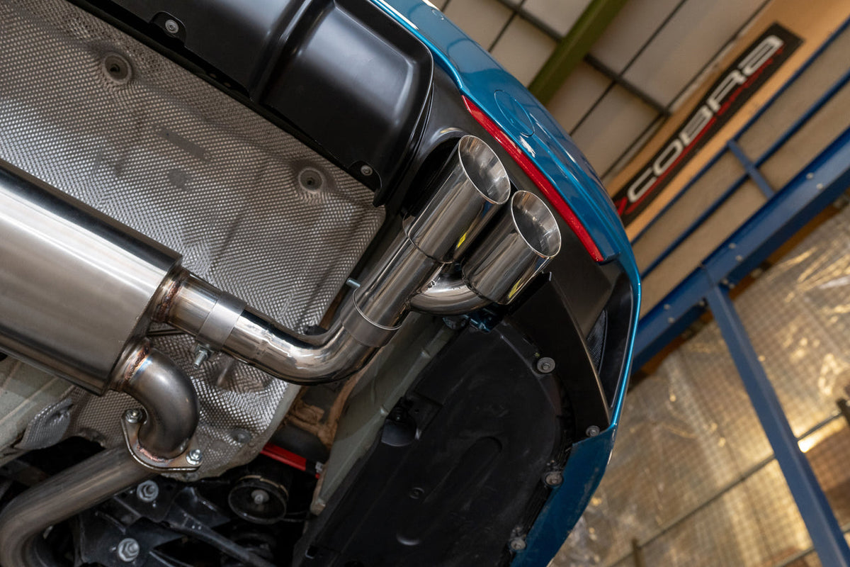 Cobra Sport BMW 325D F30 LCI quad exit M3 style performance exhaust conversion, showing the quad exhaust tips on the vehicle.