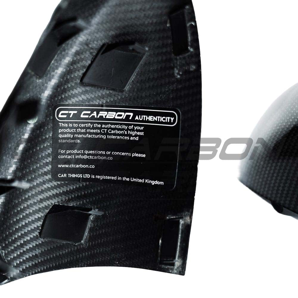 BMW E90/E92/E93 M3 carbon fiber mirrors by CT Carbon, close-up of sleek, lightweight carbon fiber side mirrors with reflective surfaces.