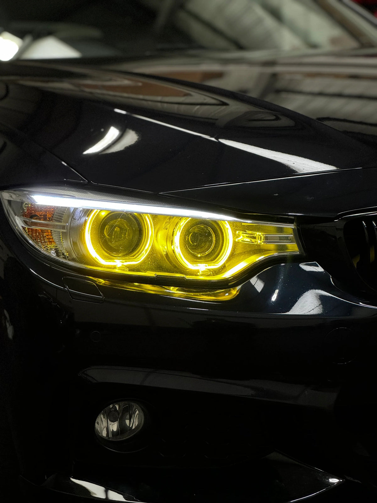 BMW F30/F31 3 Series pre-LCI yellow Xenon DRL module set by CT Carbon, showing the LED daytime running lights for 2012-2015 models.