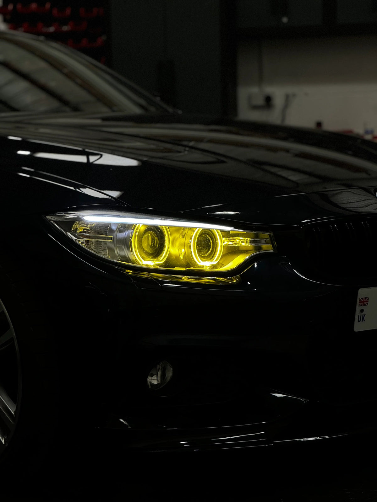 BMW F30/F31 3 Series pre-LCI yellow xenon DRL module set by CT Carbon, showing the LED daytime running lights installed on the vehicle.