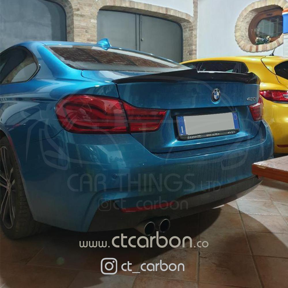 BMW F36 4 Series Coupe full carbon fibre kit with dual exhaust by CT Carbon, showing sleek carbon fibre panels and sporty dual exhaust.