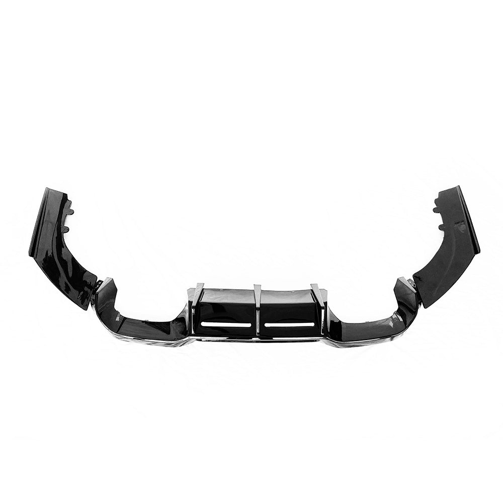 BMW F87 M2/M2C gloss black rear diffuser by CT Carbon, shown installed on the vehicle's rear bumper.
