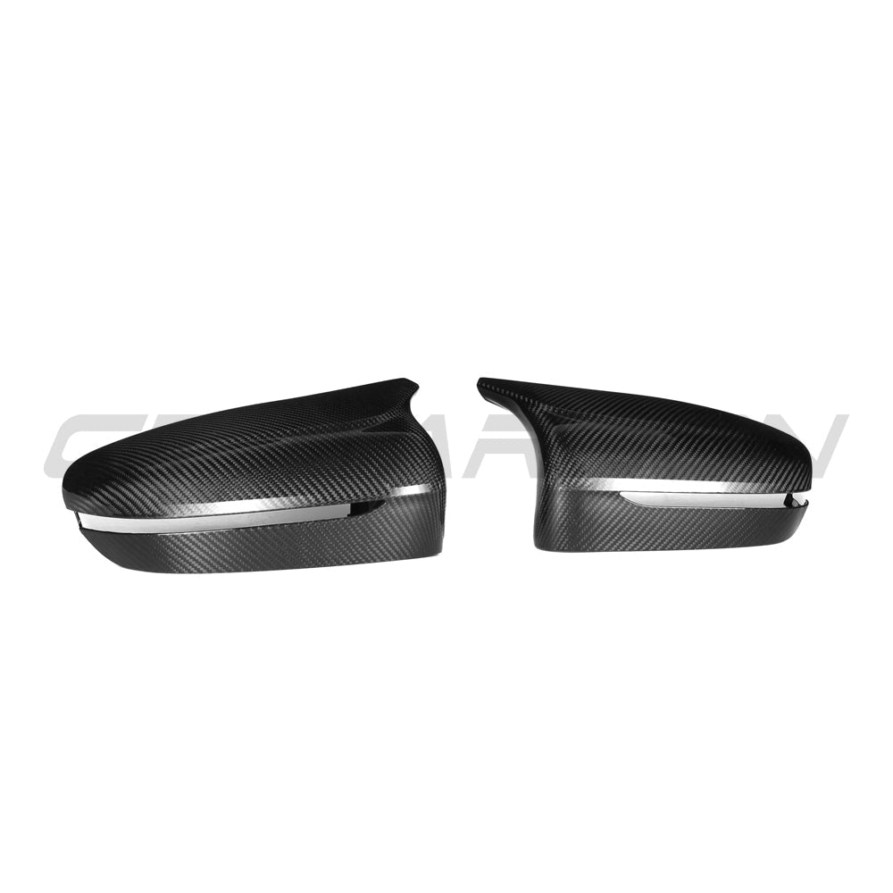 BMW F90 M5 2018-2023 pre-preg carbon fibre side mirrors for LHD models, featuring sleek black finish and aerodynamic design.
