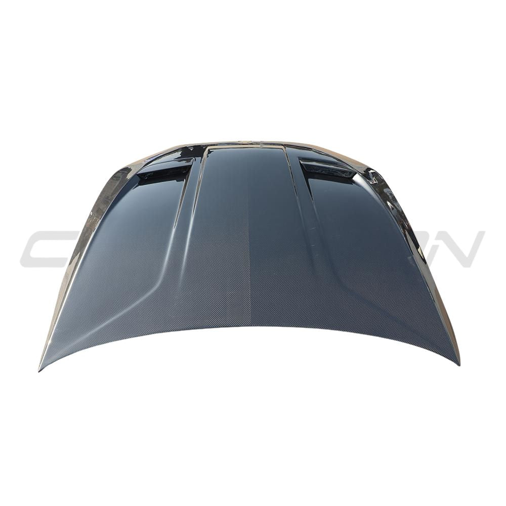 BMW F90 M5 and G30 5 Series carbon fibre bonnet by CT Carbon, showing the lightweight, aerodynamic design with visible carbon weave.