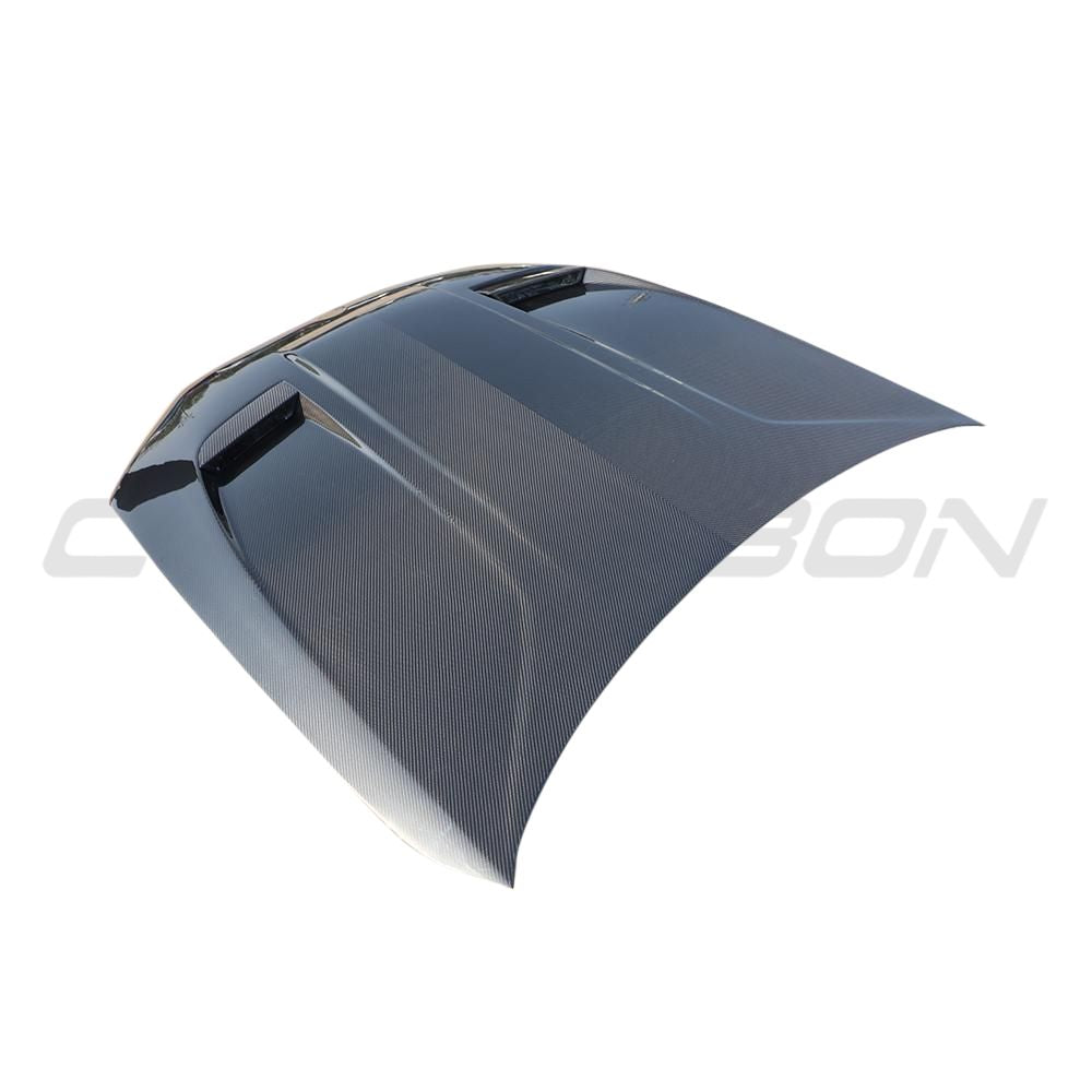 BMW F90 M5 and G30 5 Series carbon fiber bonnet by CT Carbon, showing sleek black lightweight car hood with textured finish.