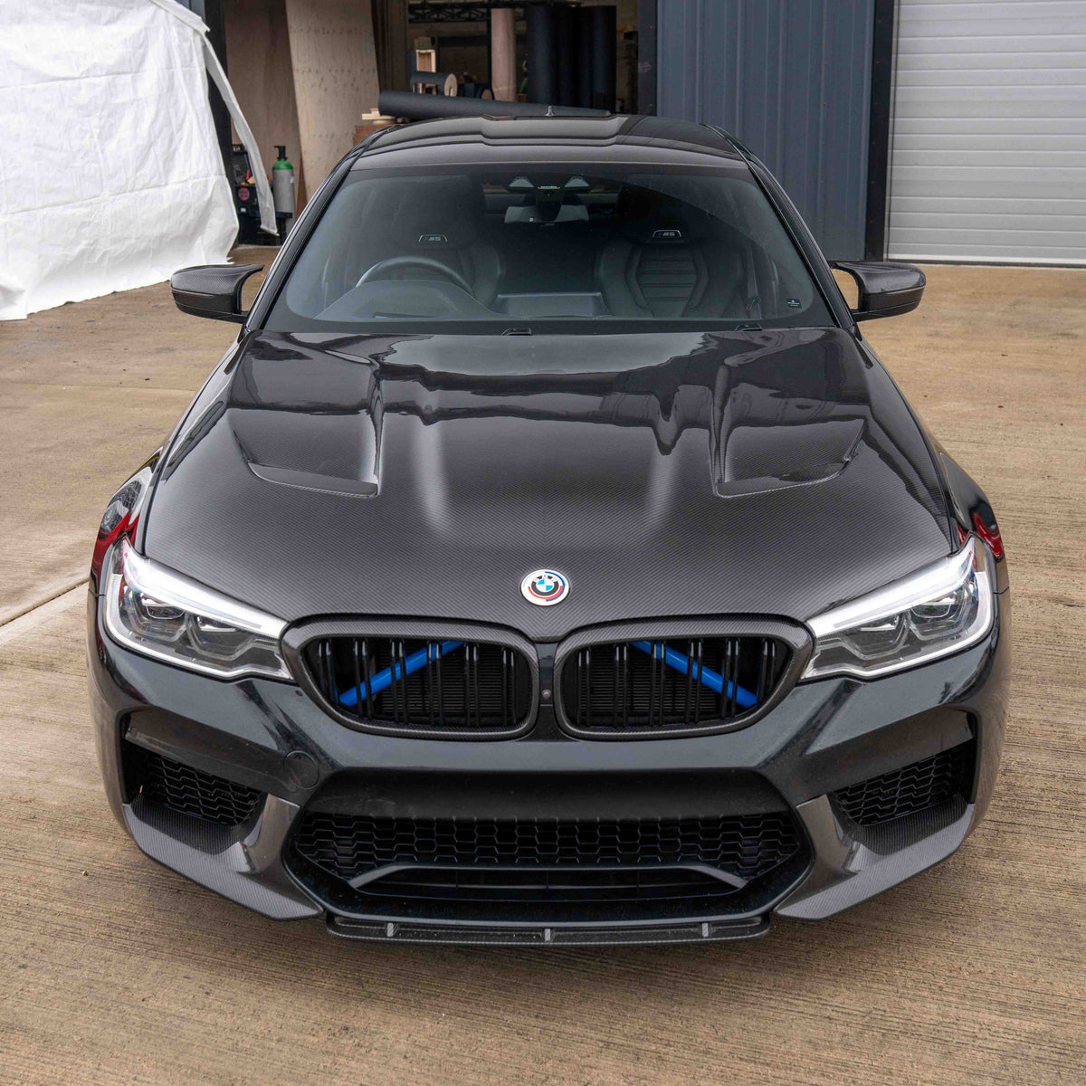 BMW F90 M5 and G30 5 Series carbon fiber bonnet by CT Carbon, showcasing the lightweight, aerodynamic car hood with a glossy finish.