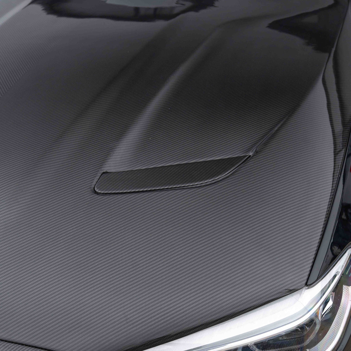 BMW F90 M5 and G30 5 Series carbon fibre bonnet by CT Carbon, showing sleek black lightweight engine cover and smooth finish.