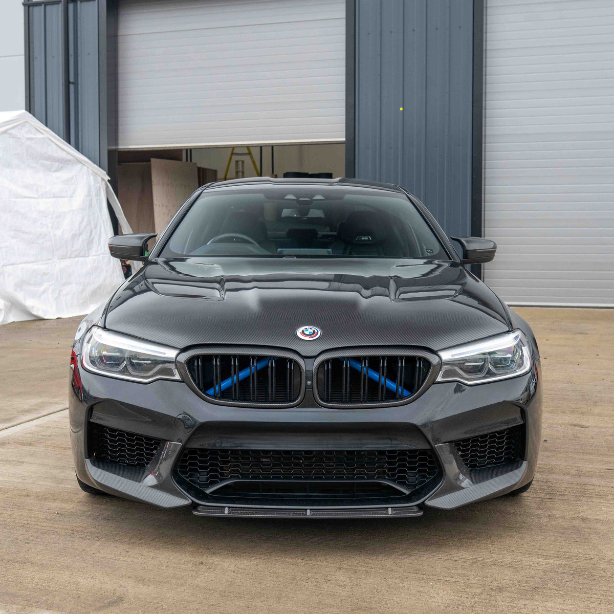 BMW F90 M5 and G30 5 Series carbon fiber bonnet by CT Carbon, showcasing sleek, lightweight carbon fiber surface and aerodynamic design.