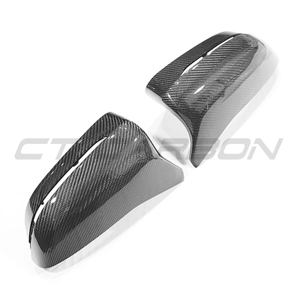 BMW F90 M5 M5 Competition carbon fibre mirror accessories by CT Carbon, LHD only, showing sleek, lightweight carbon fibre mirror housing.