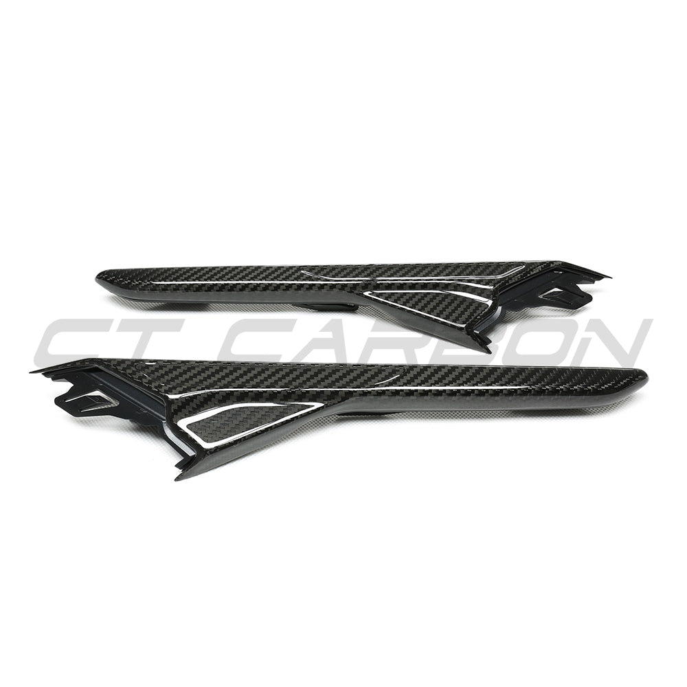 BMW F90 M5 and M5 Competition carbon fibre fender trim by CT Carbon, close-up view of sleek, lightweight car accessory.
