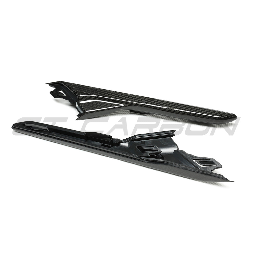 BMW F90 M5 and M5 Competition carbon fiber fender trim accessories by CT Carbon, shown installed on the vehicle's front fenders.