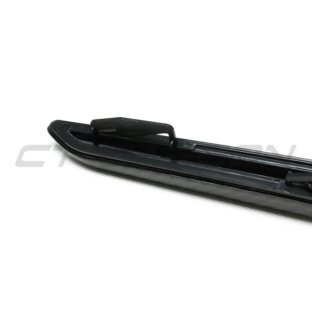BMW F90 M5 and M5 Competition carbon fibre fender trim accessory by CT Carbon, showcasing sleek, lightweight automotive styling.