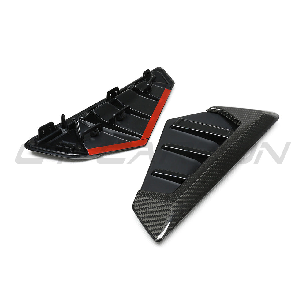 BMW F95 X5M 2023+ carbon fibre front fender trim accessory by CT Carbon, showing close-up of sleek, textured carbon fibre details.