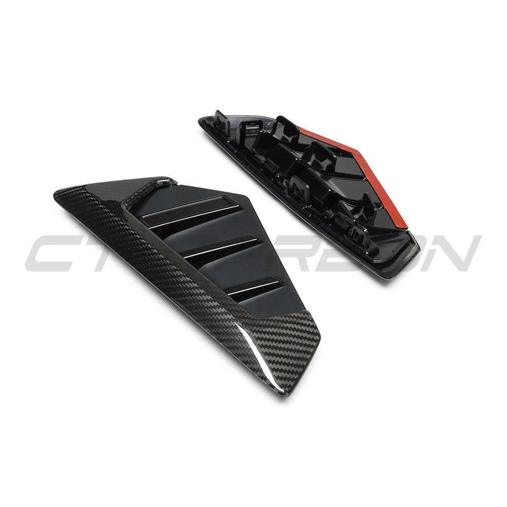 BMW F95 X5M 2023+ carbon fibre front fender trim by CT Carbon, close-up of sleek, lightweight accessory on vehicle.