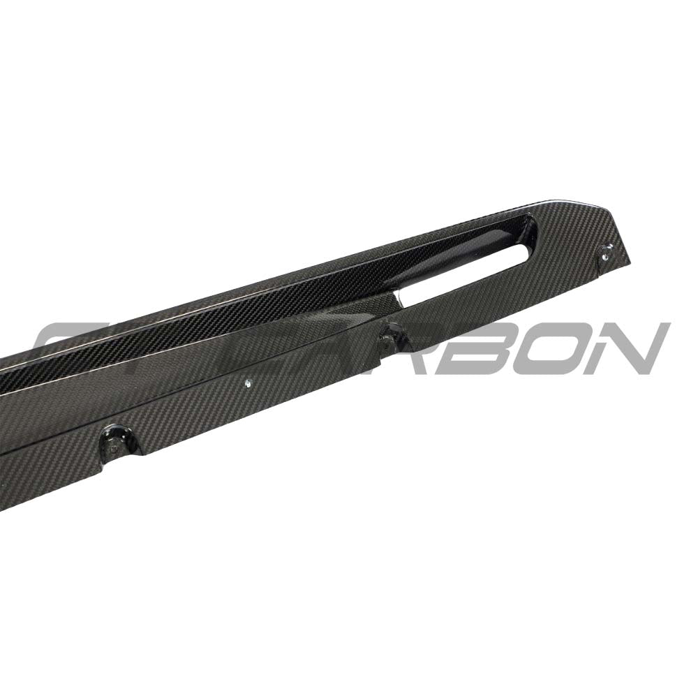 BMW G05 X5/X5M LCI 2023+ full carbon fibre kit by CT Carbon, showing side skirts on a sleek black BMW X5 M SUV.