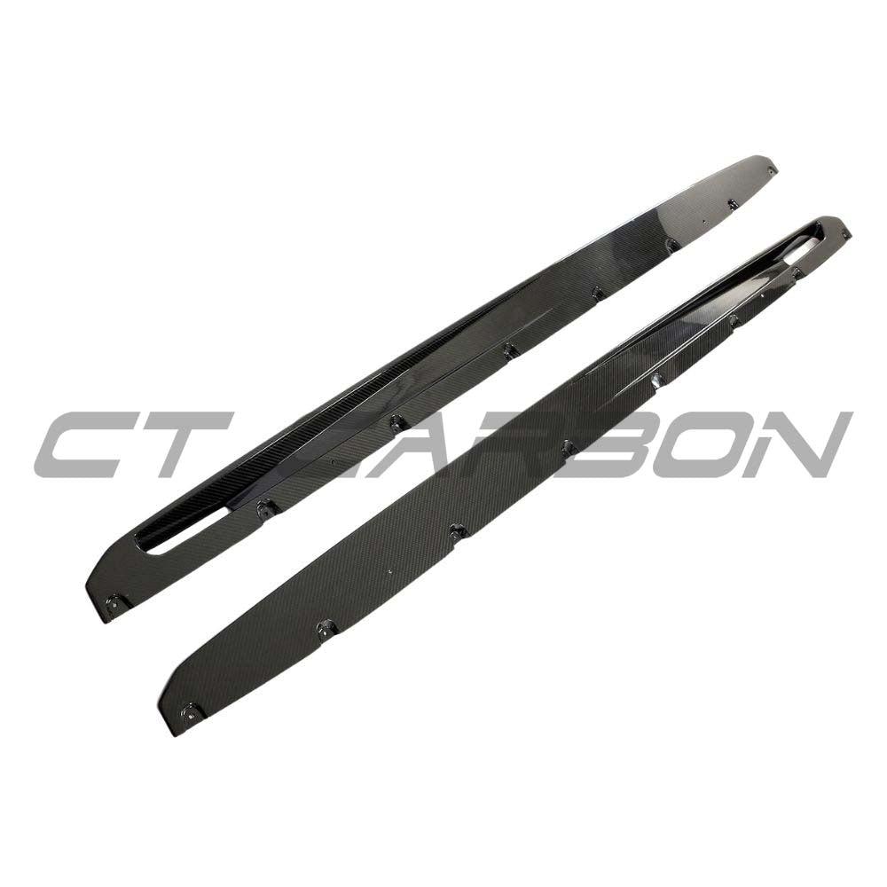 BMW G05 X5/X5M LCI 2023+ carbon fibre kit by CT Carbon, showing side skirts with a sleek, high-gloss carbon fiber finish.
