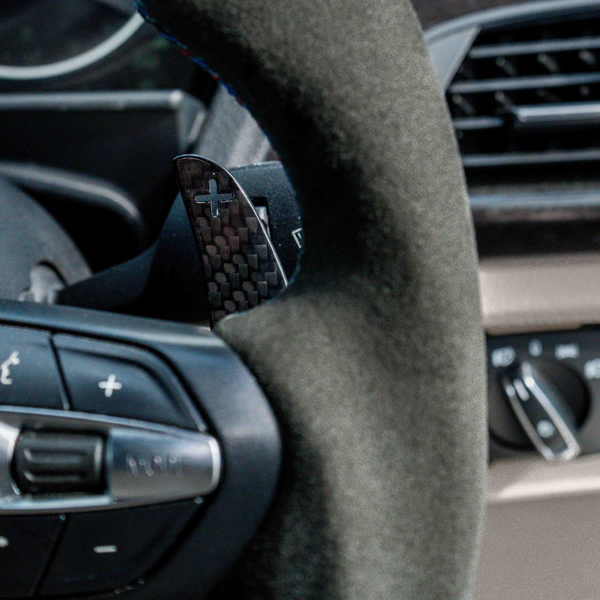 BMW Fxx carbon fibre magnetic shifter paddles by CT Carbon, sleek and lightweight automotive accessories for enhanced driving style.