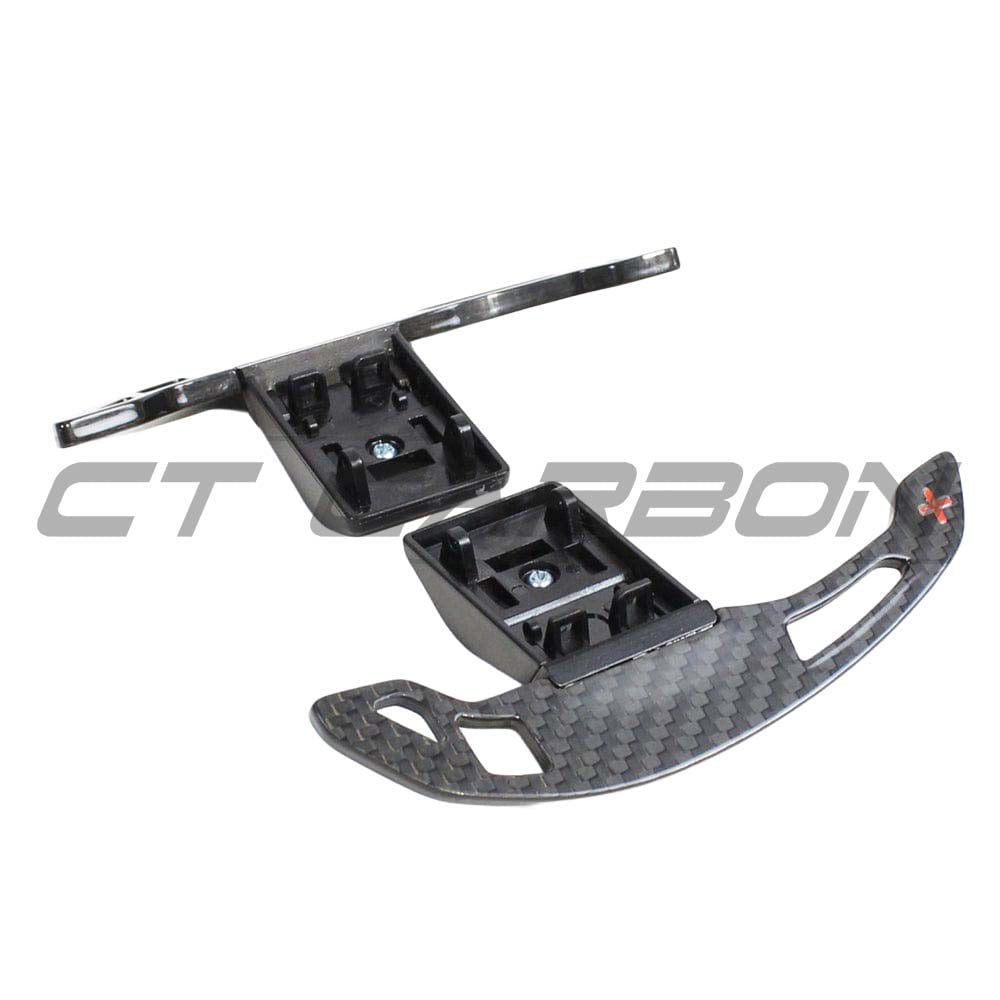 BMW Fxx carbon fiber shifter paddles by CT Carbon, close-up of sleek, lightweight racing-inspired gear shift paddles.