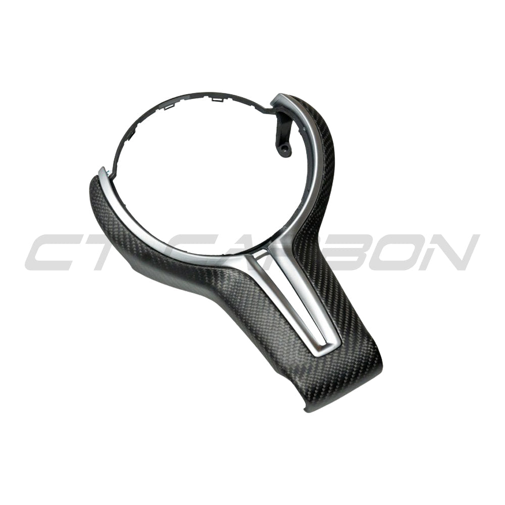 BMW Fxx M carbon fiber steering wheel trim accessory by CT Carbon, showcasing matte finish and precise fit for enhanced interior style.