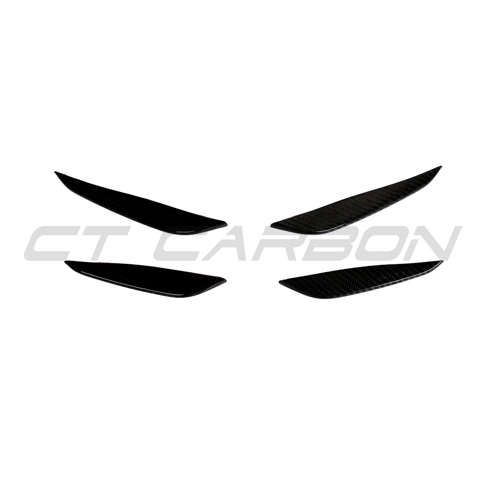 BMW G87 M2 carbon fibre front bumper canards by CT Carbon, lightweight aerodynamic accessories for enhanced sporty appearance.