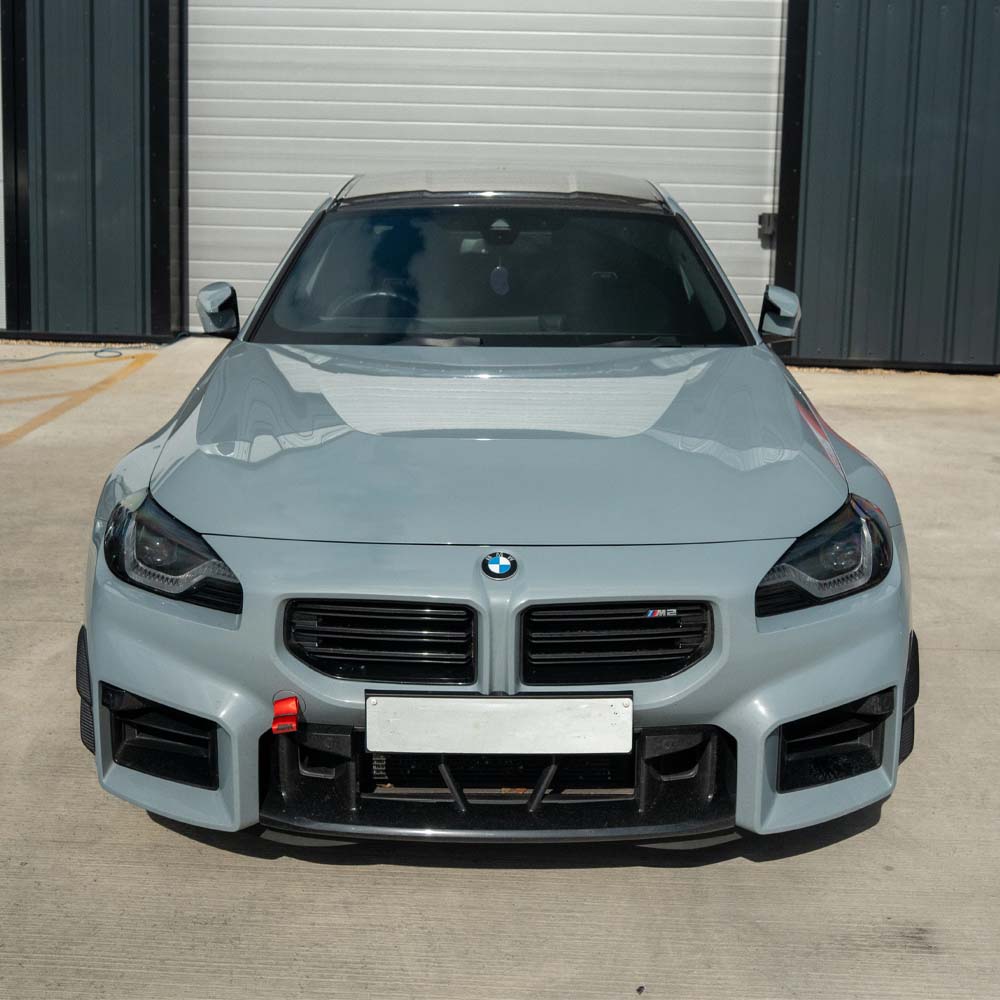 BMW G87 M2 carbon fibre front bumper canards by CT Carbon, lightweight aerodynamic accessories for enhanced sporty look.