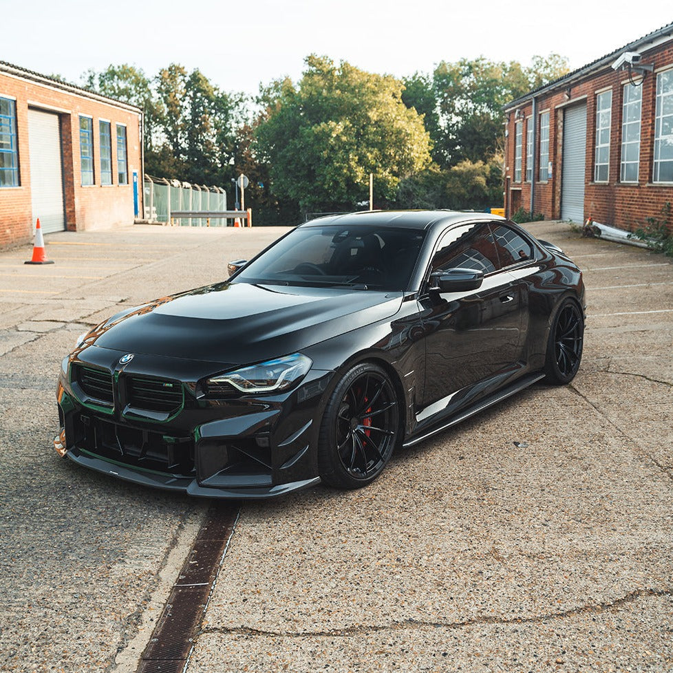 BMW G87 M2 carbon fiber front bumper canards by CT Carbon, lightweight aerodynamic accessories for enhanced sporty look.